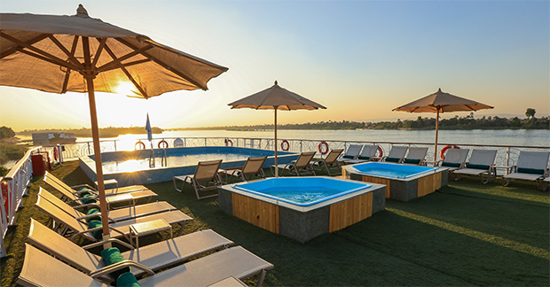 TUI Al Horeya - Pool and hot tubs at sunset